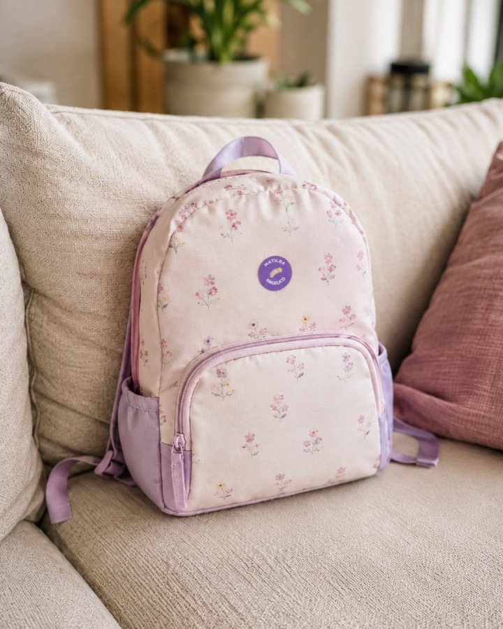Round name label on a toddler backpack