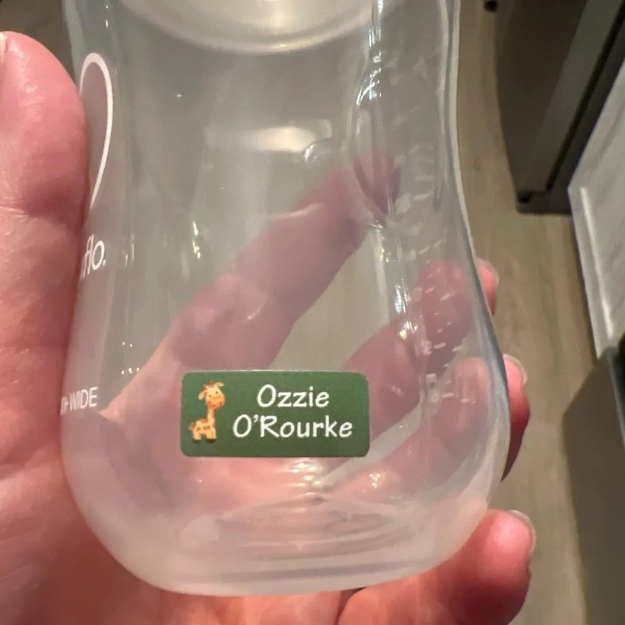 Giraffe name label on a bottle
