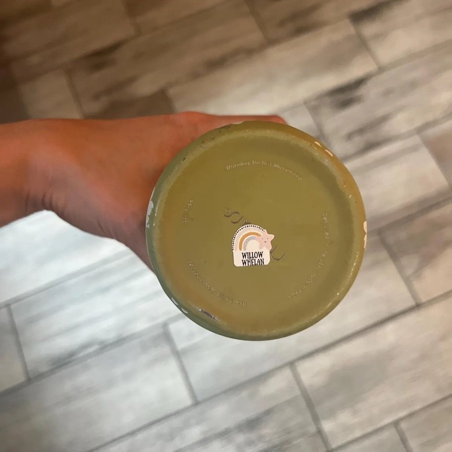 Rainbow die-cut label on the bottom of a cup