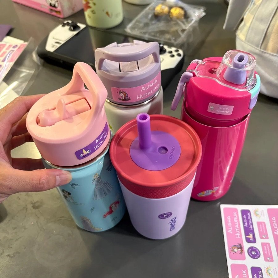 Name labels on four water bottles